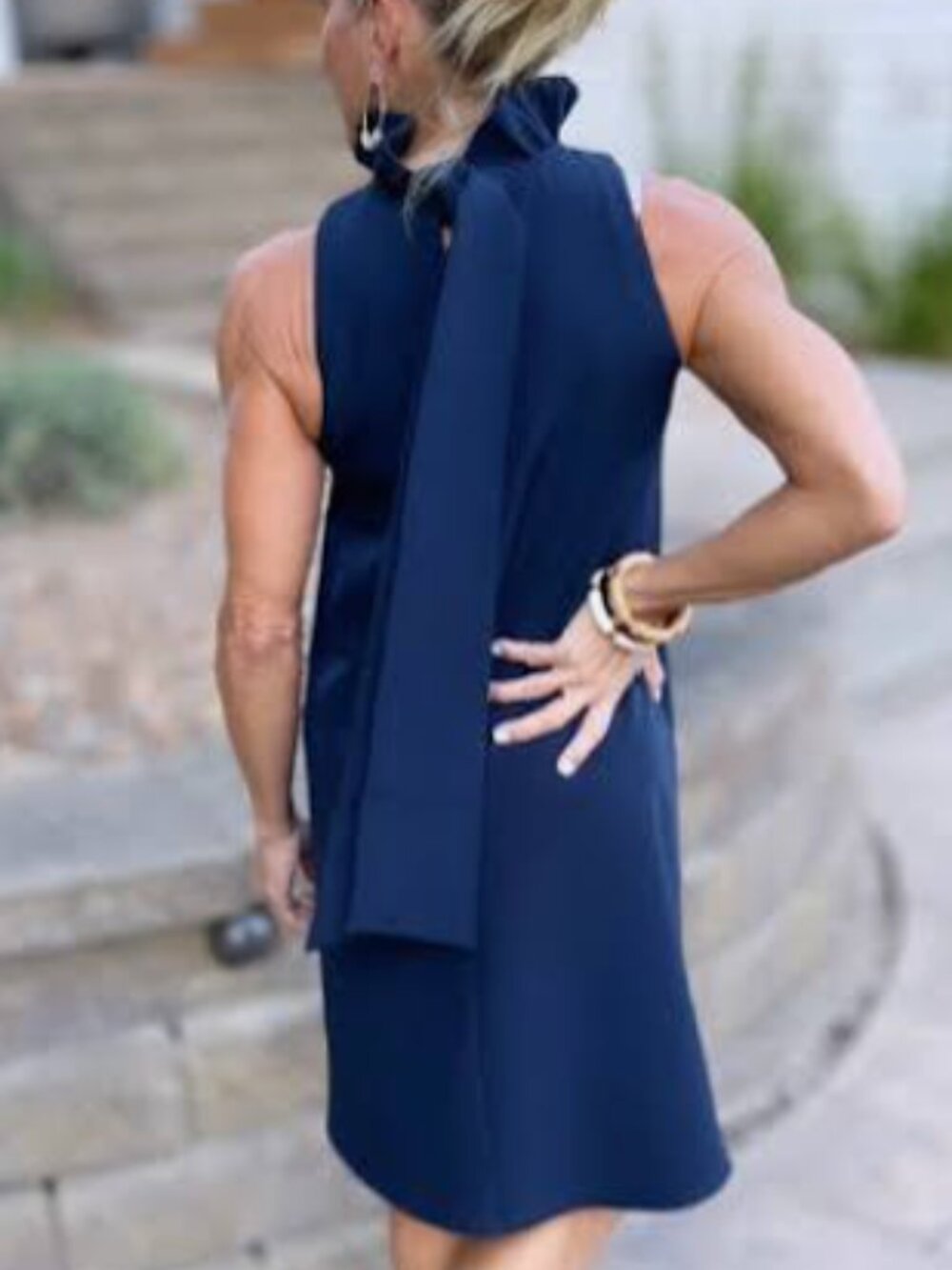 Tuckernuck Blythe Sleeveless Ruffle-Neck Dress in Deep Navy with back bow tie